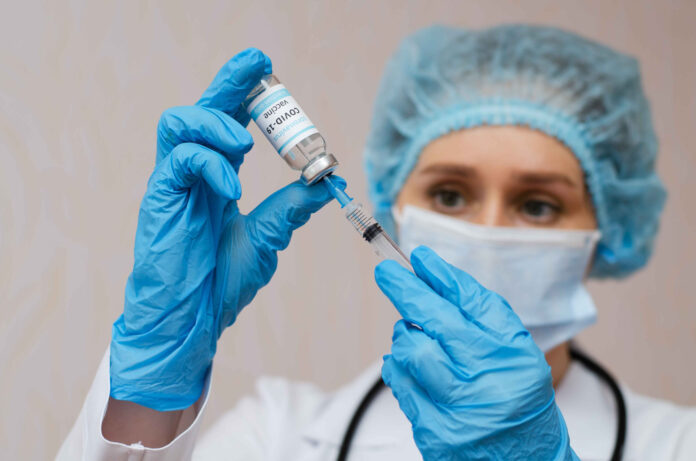 Doctor,,Nurse,,Scientist,Hand,In,Blue,Gloves,Holding,Coronavirus,,Covid-19