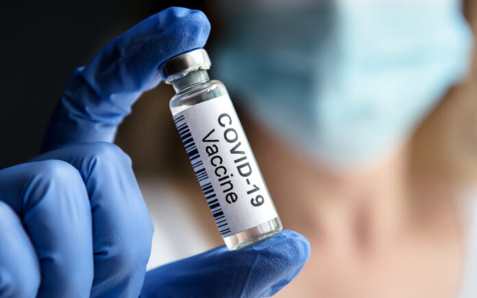 Covid-19,Vaccine,In,Doctor's,Hand.,Researcher,Holds,,Shows,Corona,Virus