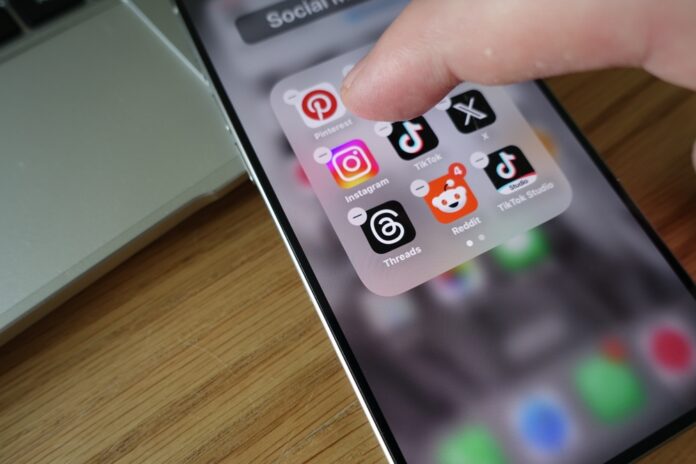 Kiel,,Sh,,Germany,,04-24-2025:,Finger,Hovering,Over,Tiktok,App,Deinstaling